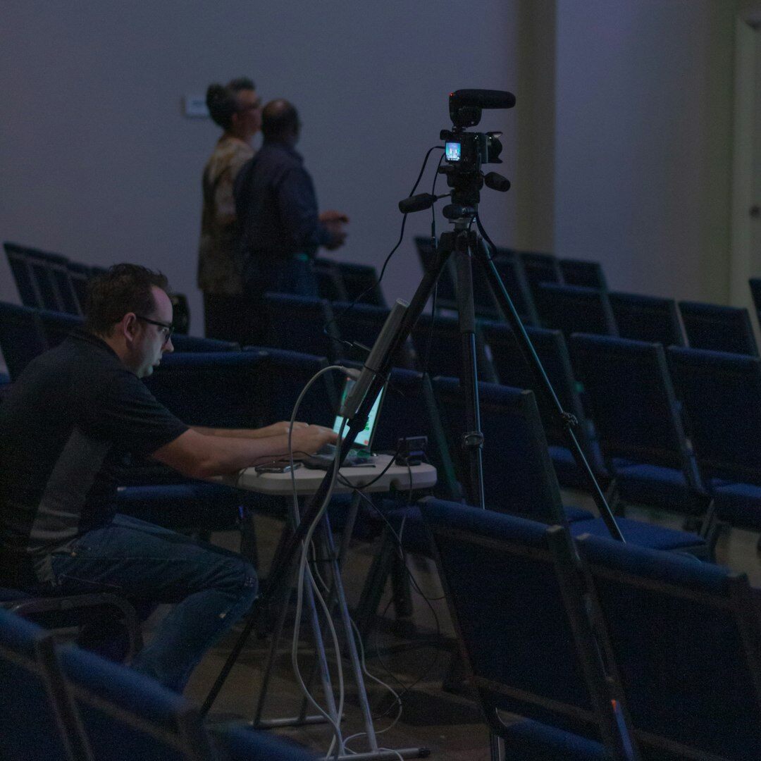 Studio camera operator filming a live broadcast