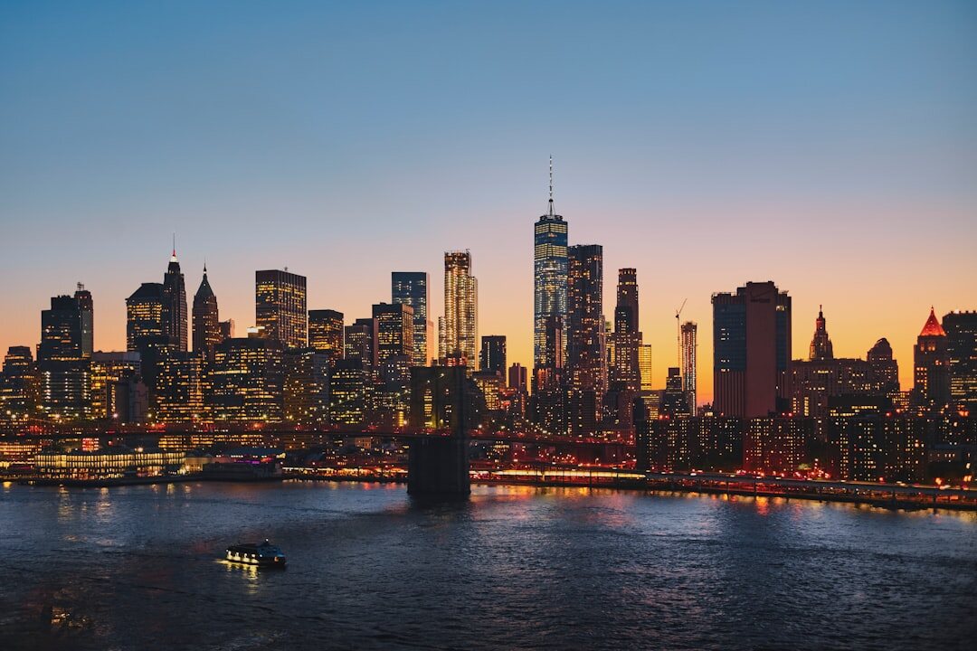 City skyline at dusk with warm lights